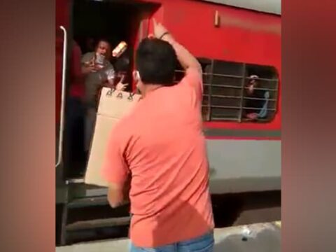 604ijdl railway officer thowing biscuits at migrants 625x300 31 May 20