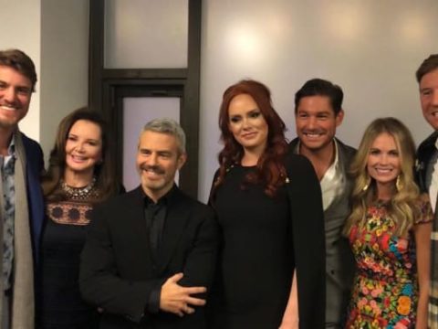 andy cohen stands with the southern charm cast