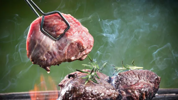 beef steaks on the grill