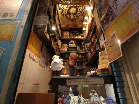 Owner Kazem Mabhutian 63 serves tea at the smallest and oldest teahouse tucked away in an alleyway of the Grand Bazaar in the Iranian capital Tehran on September 20 2021