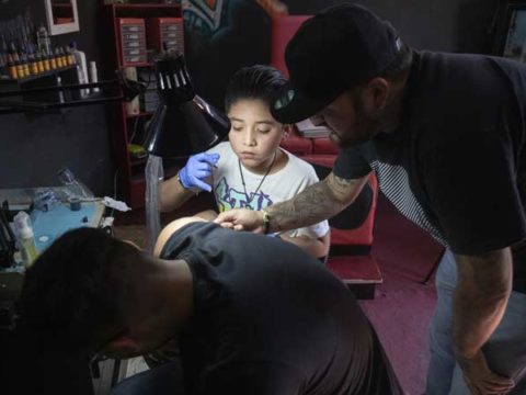 Brandon Burgos tattoos a person in the city of Puebla state of Puebla Mexico on November 10 2021.