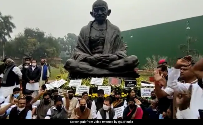 stals69g opposition mps protest at gandhi statue over suspension of the 12 rajya sabha mps