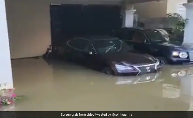 hgmdbrvo people were taken out of flooded area in a tractortrolley passing by their expensive